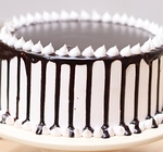 choco dripping snowy cake